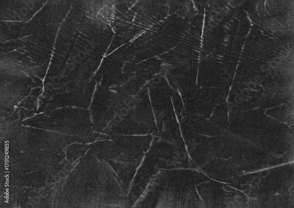 Fototapeta Black creased paper texture background. Abstract grunge surface graphic element for overlay design.