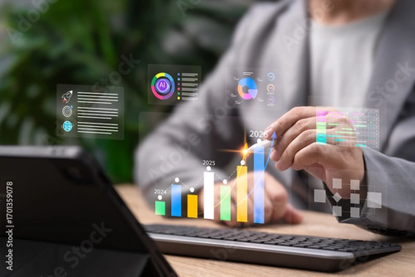 Fototapeta Business Growth 2026 Forecast, Businessman Using AI Technology and Data Analytics for Market Analysis, Workflow, Economic Strategy, Corporate Goal Setting, Digital Transformation,Strategic Development