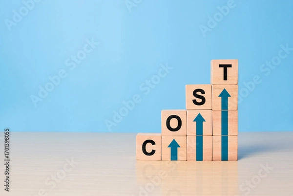 Fototapeta Cost increase and inflation concept. The word cost on wooden cubes with arrows going up.