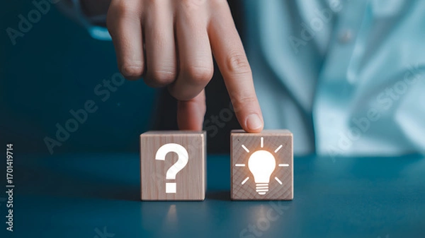 Obraz Find solutions with creative thinking by turning question into idea on wooden blocks