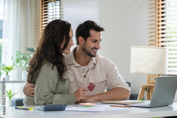 Fototapeta Couple using credit card pay the bill online shopping, making payment and browsing modern platform.