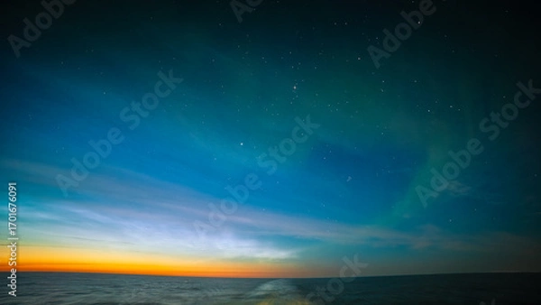 Obraz Noctilucent Clouds and faint Northern Lights, off the Coast of Iceland August 2025. 
