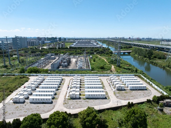 Fototapeta Aerial view of battery energy storage systems under a clear blue sky