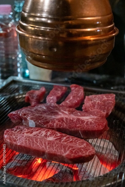 Fototapeta Hanwoo Beef, Korean Style Meat on the Grill. BBQ rare meat with soft focus