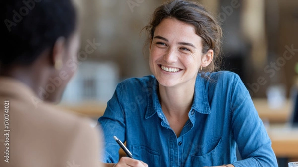 Fototapeta Engaging conversation in human resources during a recruitment meeting with employees