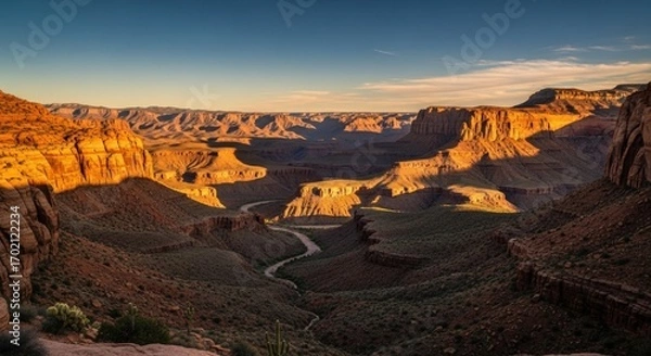 Fototapeta Scenic grand canyon landscape view at sunset with a winding river below cliffs