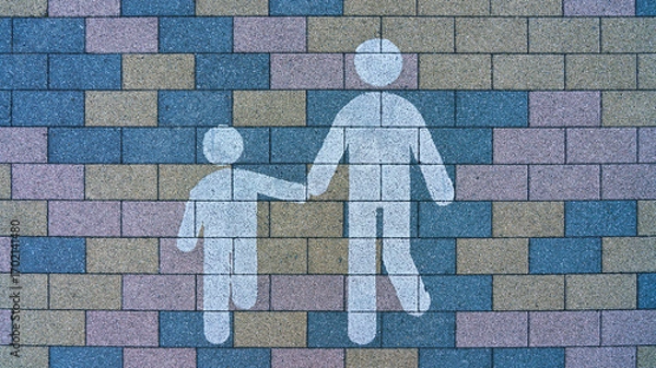 Fototapeta Tokyo, Japan - Oct 13 2024, A close-up view of a brick sidewalk with a Pedestrian zone sign in the form of silhouettes of two stickmen on one of the streets of Tokyo, Japan