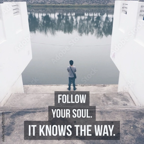 Obraz Inspirational motivational quote "Follow your soul. It knows the way" on man standing by the river background.