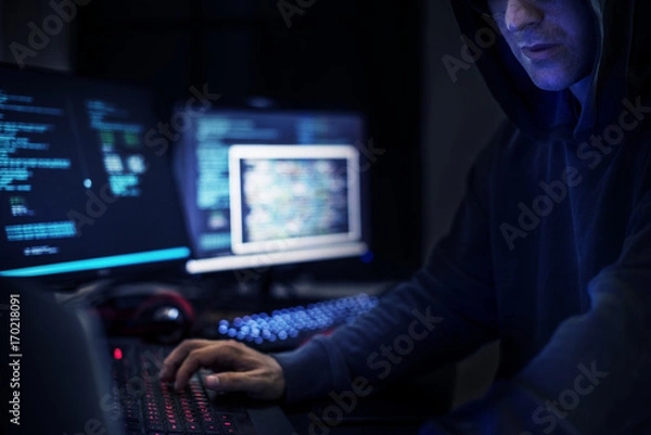 Fototapeta Hacker man working on computer