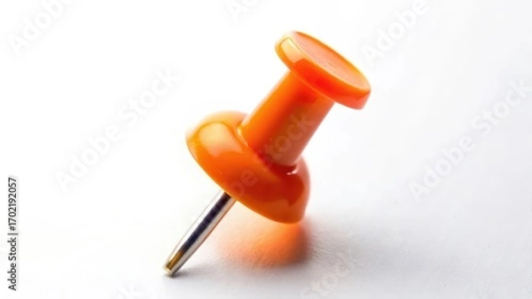 Fototapeta Orange Push Pin on White Background Close Up Macro Shot