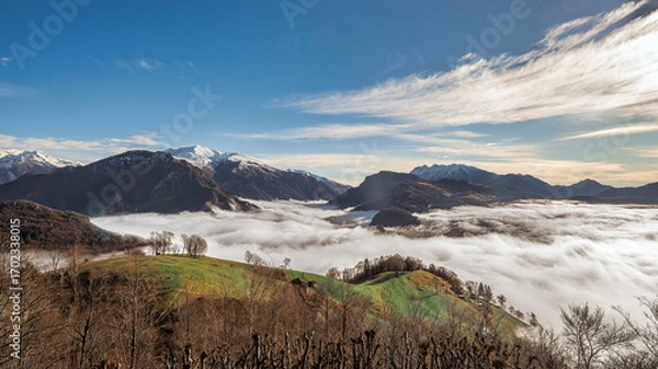 Fototapeta Fog in the valley under the hills and mountains