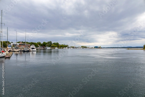 Obraz Tranquil waterfront scene at Little Current, Manitoulin Island, featuring the historic swing bridge against a serene sky and calm waters.
