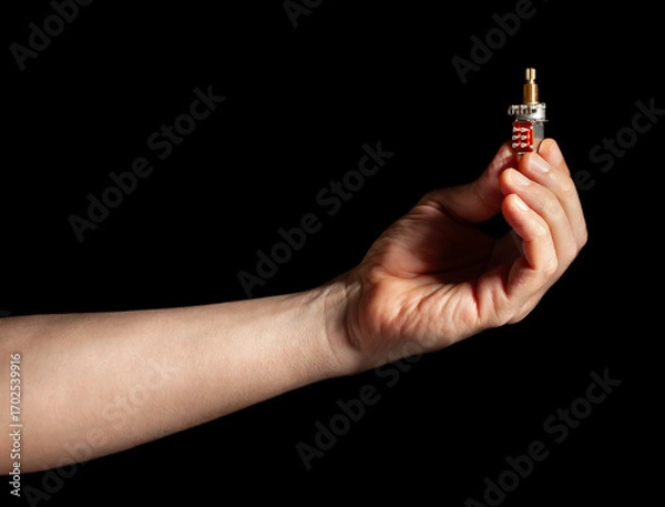 Fototapeta guitar push pull potentiometer in hand on black background