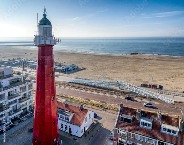 Fototapeta Red Lighthouse by the Seashore at Scheveningen, The Hague