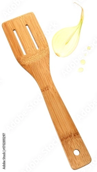 Fototapeta Wooden spatula and sliced onion