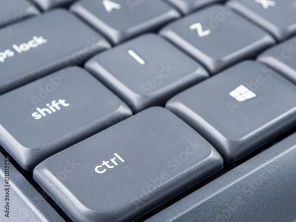 Obraz Gray keyboard with focus on Strl and Shift buttons and soft focus on back