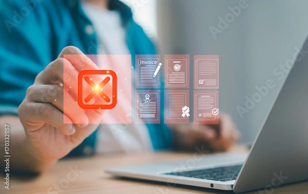 Obraz Businessman pressing cancel icon on virtual screen with invoice and document files for concept of rejection, error failed approval and financial document management.