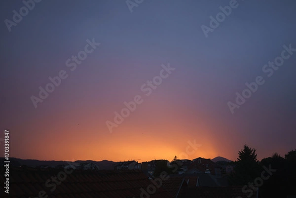 Obraz Balkan city at dusk with interesting colors in the sky