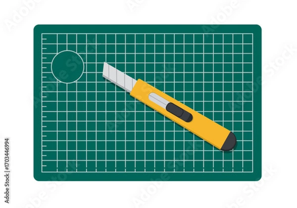 Obraz A utility knife rests on a selfhealing cutting mat