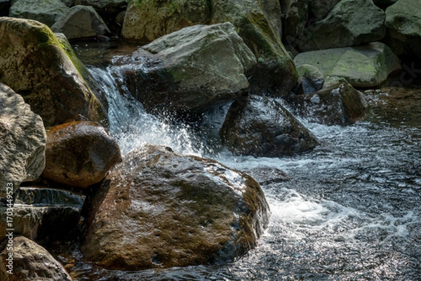 Obraz Close up of river flows between stone, in New Taipei City, Taiwan.