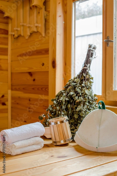 Fototapeta Composition with different accessories and cosmetics for sauna on wooden background