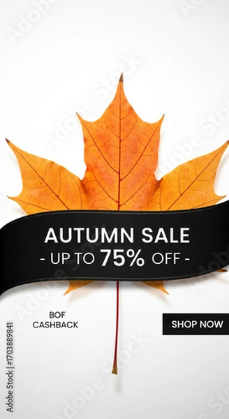 Fototapeta Orange maple leaf with black ribbon banner displaying "Autumn Sale - Up to 75% Off", showcasing autumnal theme and seasonal discounts, ideal for promotional material