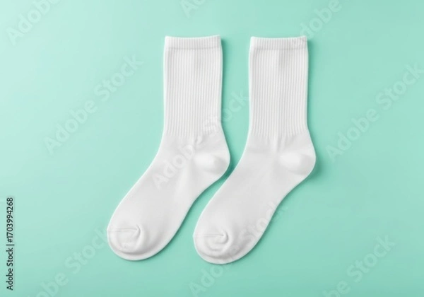 Obraz Pair of simple white ribbed socks on mint green background soft texture and clean colors minimalist fashion
