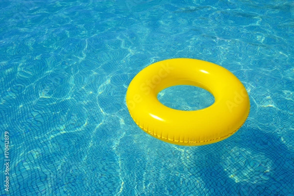 Fototapeta Colorful inflatable tube floating in swimming pool