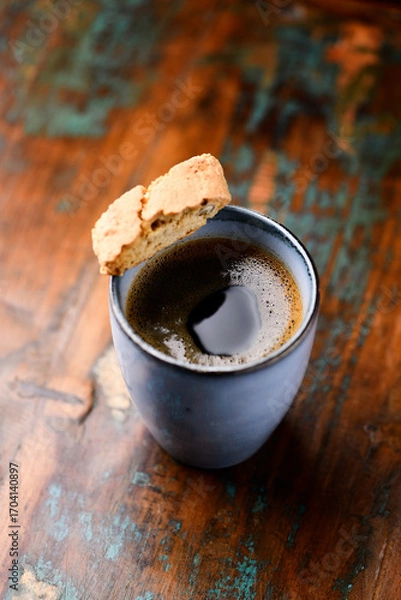 Fototapeta Cup of coffee on rustic wooden background. Soft focus. Copy space	