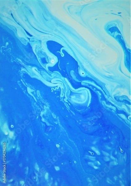 Fototapeta Blue abstract background. The acrylic paint flows freely and creates an interesting pattern.