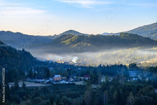 Fototapeta View of the village of Kosmach at dawning. Kosmach is a village located in the Carpathian Mountains, in Kosiv region, Ivano-Frankivsk Oblast, Ukraine. Autumn morning landscape.