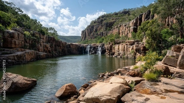 Fototapeta Waterfall into a Pool with Sandstone Cliffs