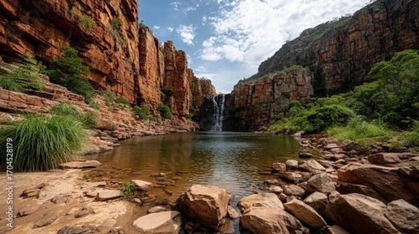 Fototapeta Waterfall with Red Rock Cliffs and Pool