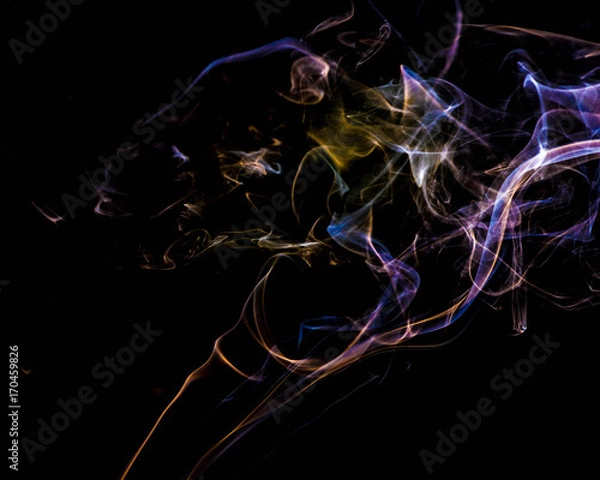 Obraz multicolored smoke dissipates in the air on an isolated black background