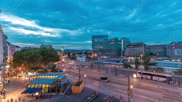 Fototapeta The Schwedenplatz is a square in central Vienna, located at the Danube Canal aerial day to night timelapse