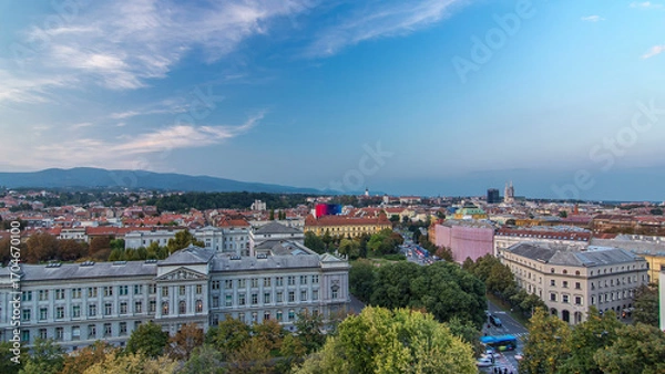 Fototapeta Panorama of the city center day to night timelapse with intersection in front of national theater and museum in Zagreb, Croatia.