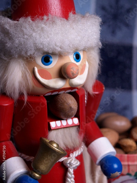 Fototapeta santa nutcracker cracking a pecan