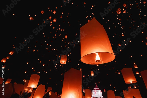 Fototapeta Floating lanterns take place during Thailand's Loi Krathong festival on the night of the full moon.