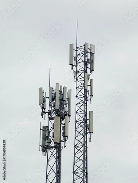 Fototapeta Telecommunication tower of 4G and 5G cellular. Cell Site Base Station. Wireless Communication Antenna Transmitter. Telecommunication tower with antennas.