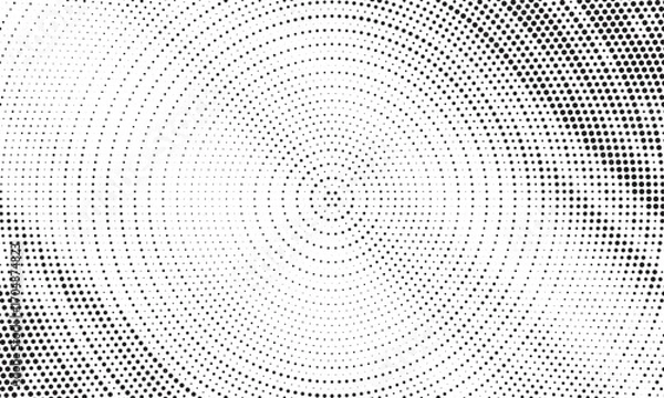 Fototapeta Radial halftone dots. Spotted and dotted stains gradient background. Concentric comic texture with fading effect. Black and white rough gritty wallpaper. Grunge monochrome geometric backdrop. Vector