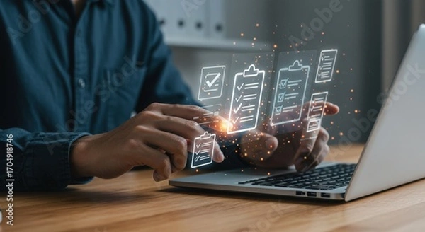 Fototapeta Man interacting with digital battery level indicators on a laptop