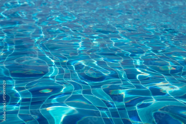 Obraz Sunlight creating beautiful ripples on swimming pool water surface