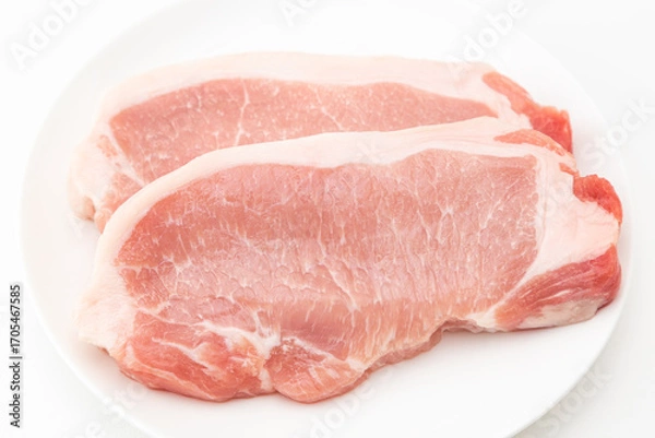 Fototapeta 皿に乗った豚ロース厚切り肉　白バック