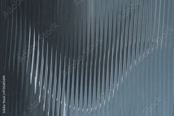 Fototapeta A closeup abstract view of a corrugated metal surface with a textured, ribbed pattern creating a sense of depth and shadow
