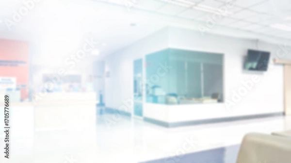 Fototapeta Blur abstract background of corridor in clean hospital. Blurry view of aisle in office with light floor. Defocus walkway in white light building hall with patient registration at reception desk.