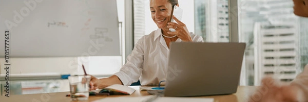Fototapeta A Professional Businesswoman Engaged in Work within a Modern Office Setting and Environment