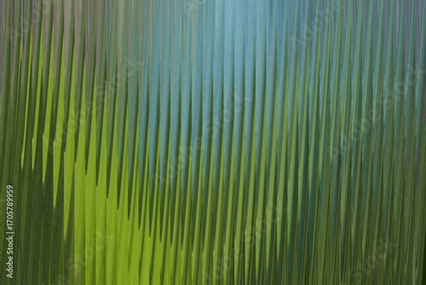Fototapeta Abstract vertical lines of green and blue create a textured, organic pattern resembling grass or reeds