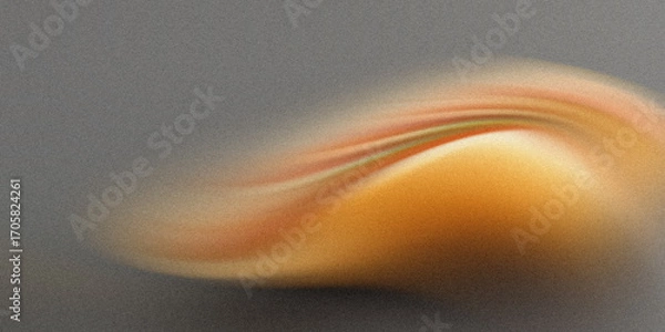 Fototapeta A vibrant, abstract swirl of orange and yellow hues flows across a textured, dark gray background, creating a sense of dynamic movement and energy