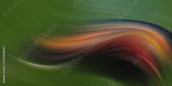 Fototapeta A vibrant abstract swirl of fiery colors, including red, orange, and yellow, emerges from darkness against a textured green background, creating a sense of dynamic motion and energy
