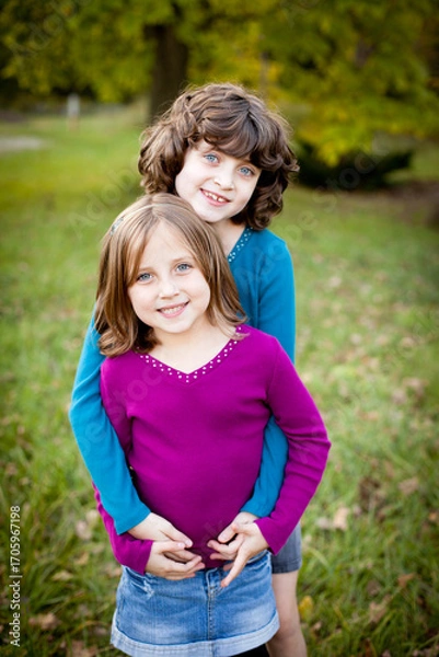 Obraz Two Happy Sisters Standing Together Outside